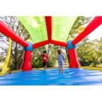 Bounceland Inflatable Party Castle Bounce House Bouncer, 16 ft L x 13 ft W x 10.3 ft H, Basketball Hoop, Removable Sun Roof, UL Strong Blower included, Fun Slide and Bounce Area, Castle Theme for Kids